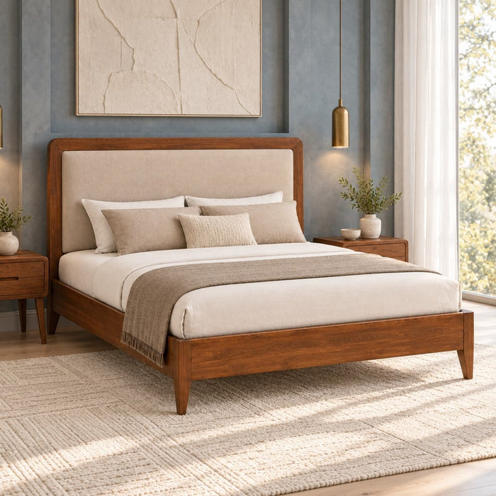 Aavrunya solid mango wood bed with beige upholstered headboard in walnut finish, styled in a modern bedroom with bedside tables